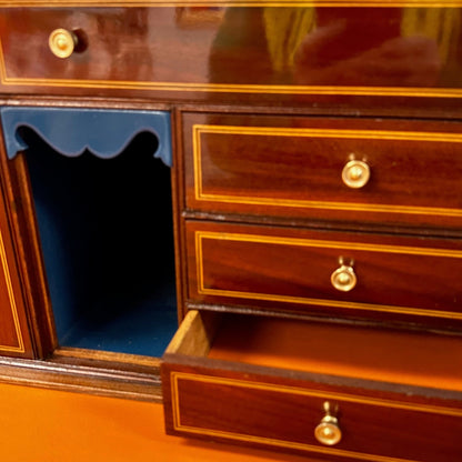 Vintage secretary drawers with orange leather lining