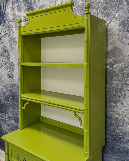 Vintage faux bamboo dresser with upper hutch, refinished in glossy olive green lacquer. Features three drawers and three open shelves with updated vintage-style brass hardware.