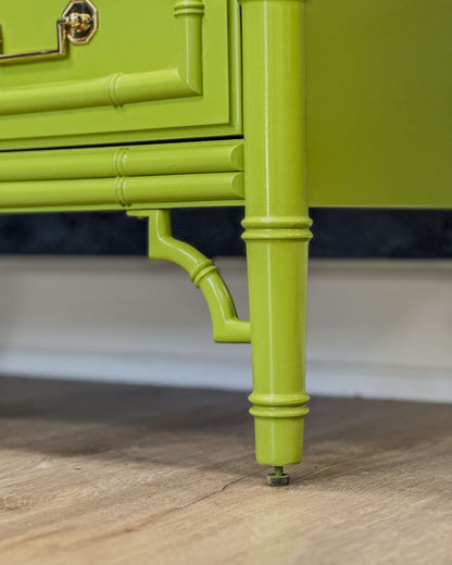 Vintage faux bamboo dresser with upper hutch, refinished in glossy olive green lacquer. Features three drawers and three open shelves with updated vintage-style brass hardware.