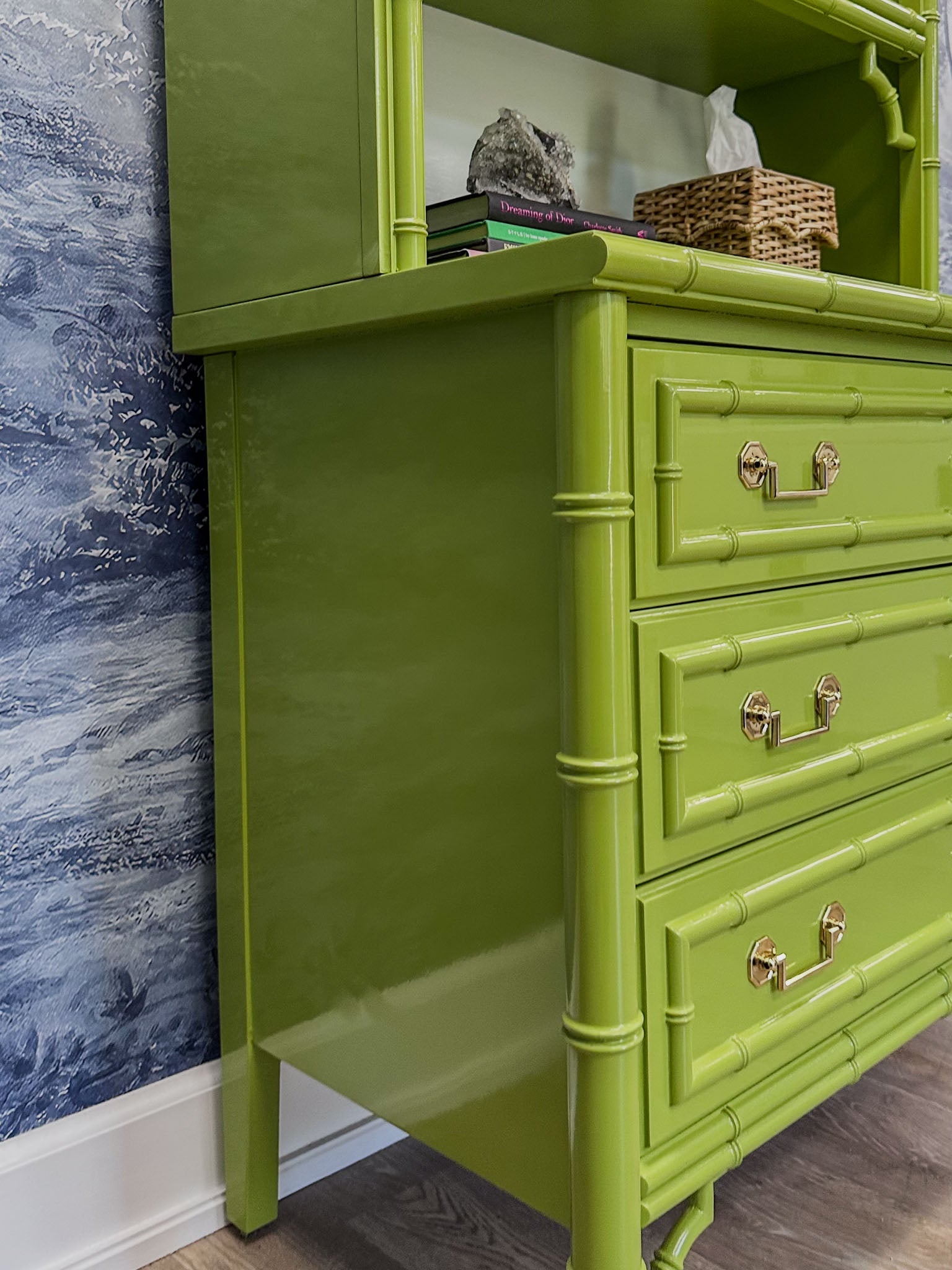 Vintage faux bamboo dresser with upper hutch, refinished in glossy olive green lacquer. Features three drawers and three open shelves with updated vintage-style brass hardware.