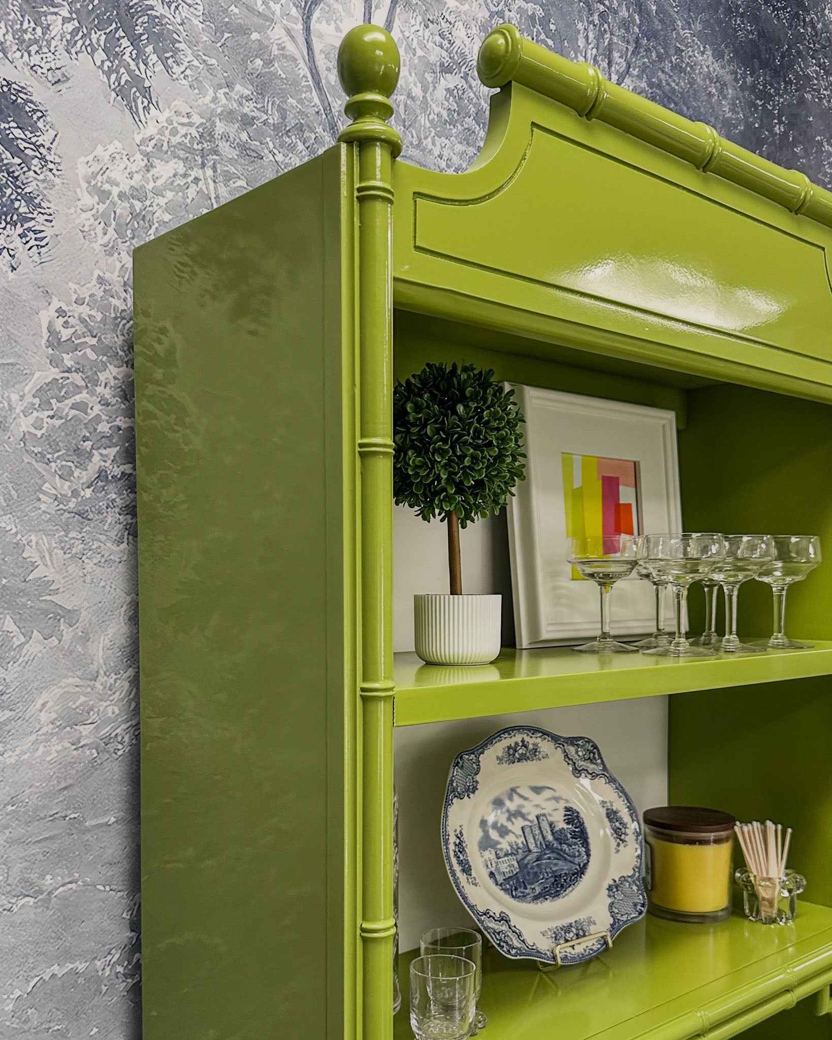 Vintage faux bamboo dresser with upper hutch, refinished in glossy olive green lacquer. Features three drawers and three open shelves with updated vintage-style brass hardware.