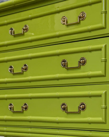 Vintage faux bamboo dresser with upper hutch, refinished in glossy olive green lacquer. Features three drawers and three open shelves with updated vintage-style brass hardware.
