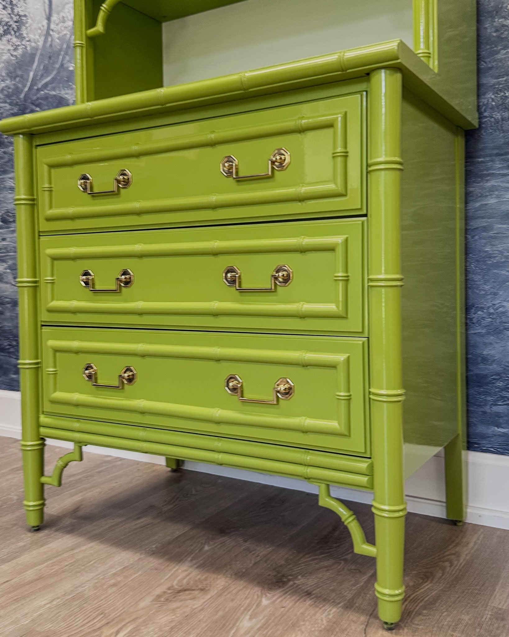 Vintage faux bamboo dresser with upper hutch, refinished in glossy olive green lacquer. Features three drawers and three open shelves with updated vintage-style brass hardware.